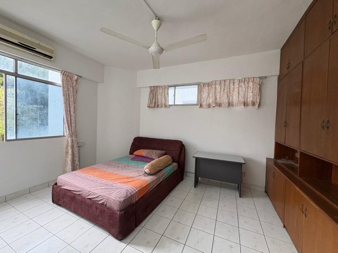 Bedroom with built-in cabinetry inside Colonnades Condominium