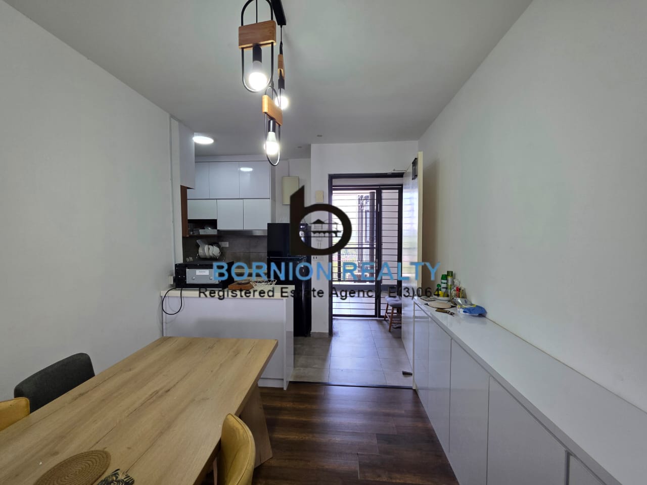 Dining area and kitchen inside Maya Condominium