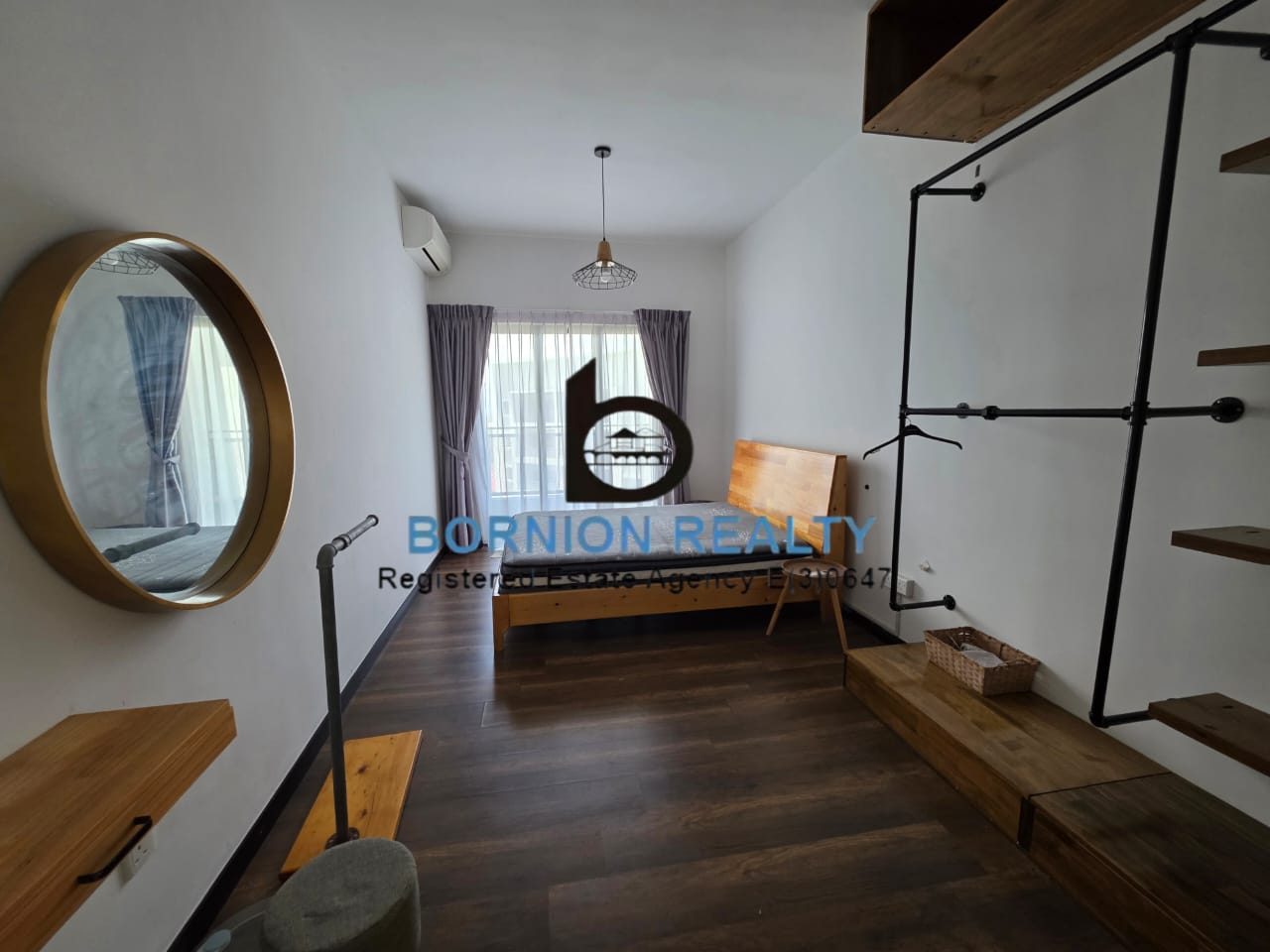 Bedroom with wood furnishings inside Maya Condominium