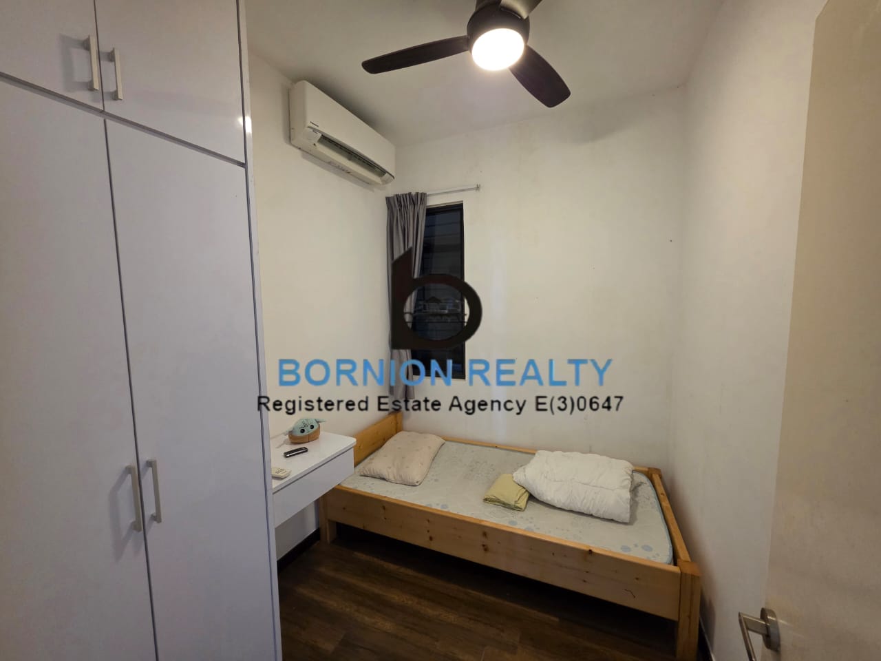 Bedroom with built-in wardrobe inside Maya Condominium