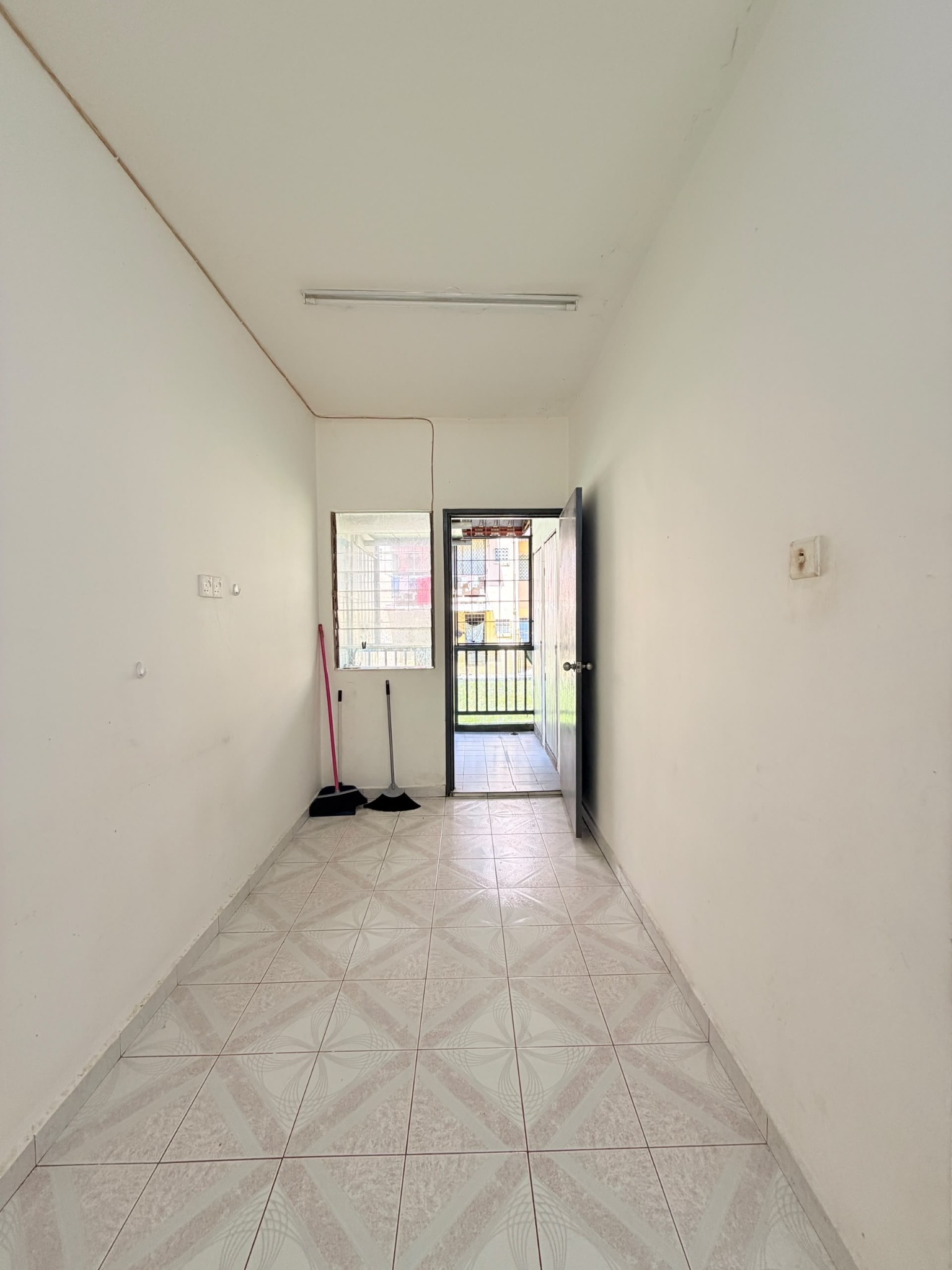 Living space leading to the kitchen at Telipok Ria Apartment